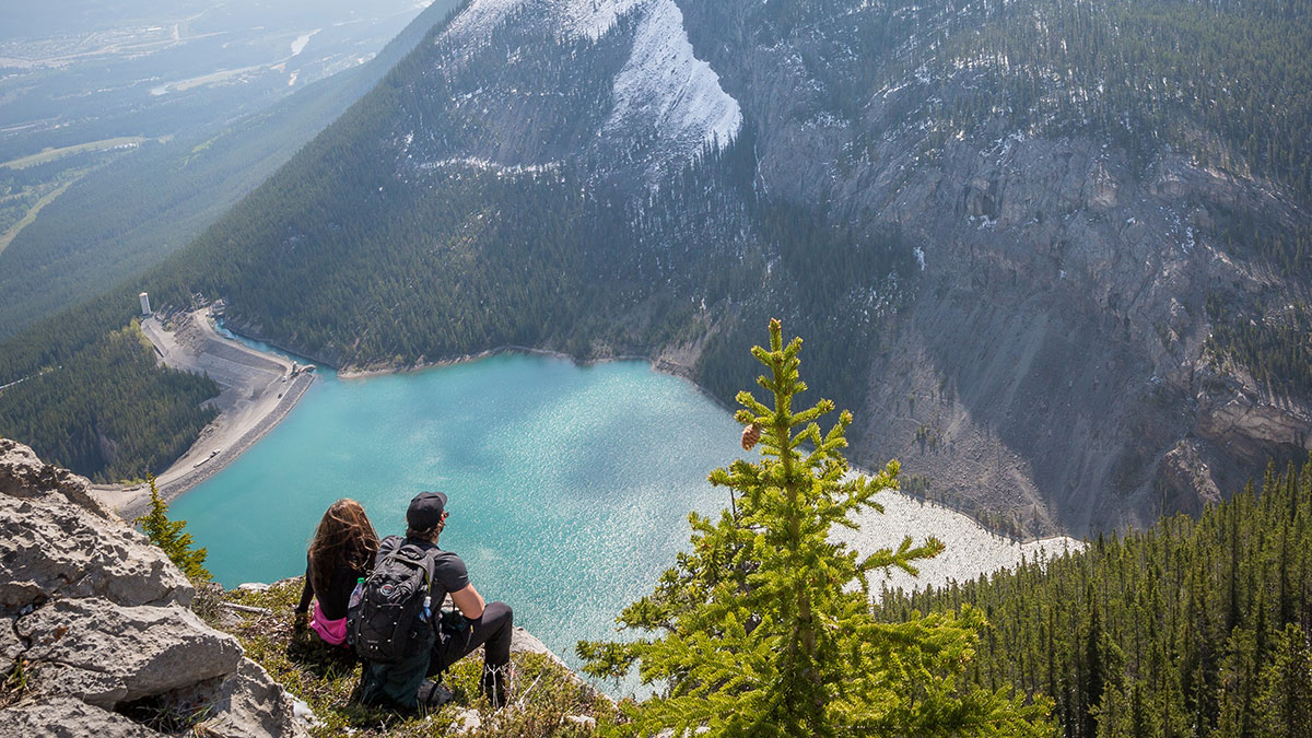 Couple overlooking mountain lake